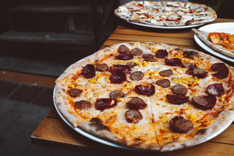 Spicy meat lovers pizza with sausage pepperoni and ground beef from Jet's pizza